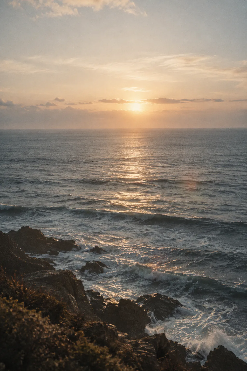 Quiet ocean horizon in luminous golden light
