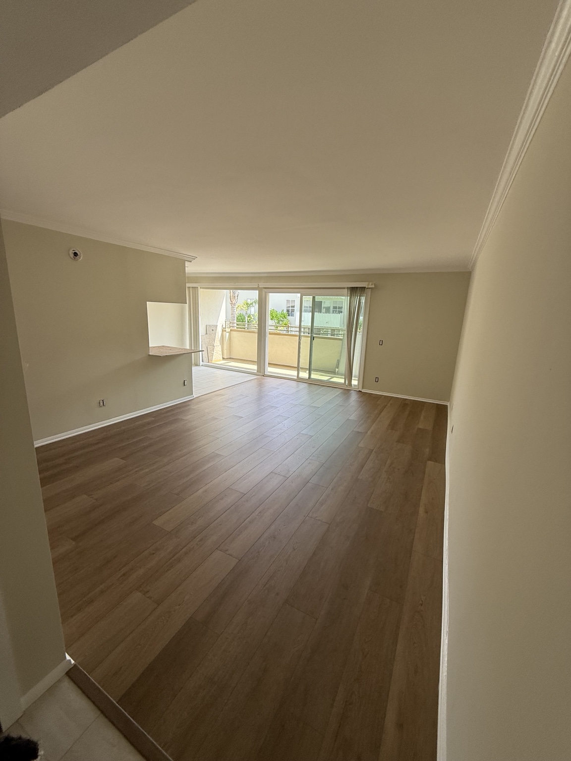 An empty, sunlit room waiting to become a home